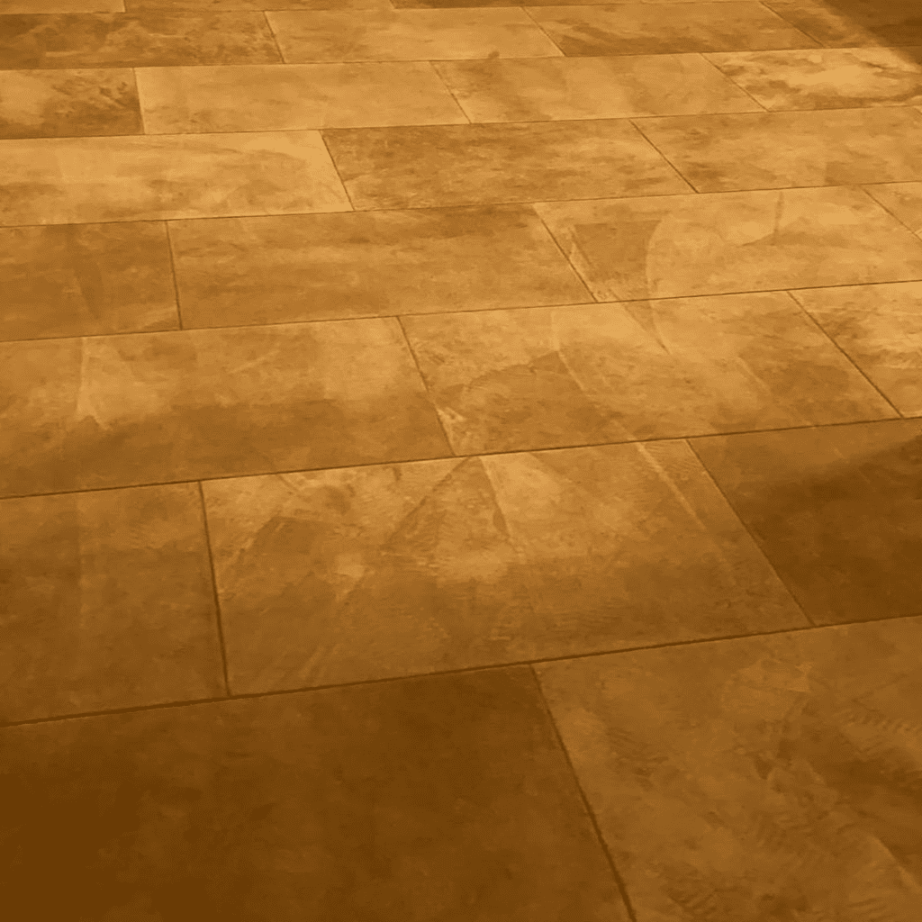Detailed close-up of gold-colored suede leather flooring.